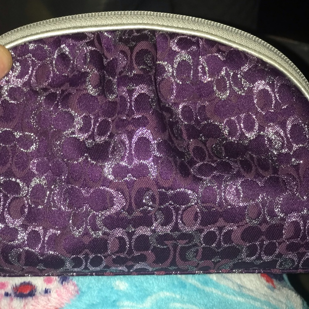 Purple Coach makeup bag